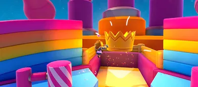 A Fall Guys character grabbing the Fall Mountain crown for the win!
