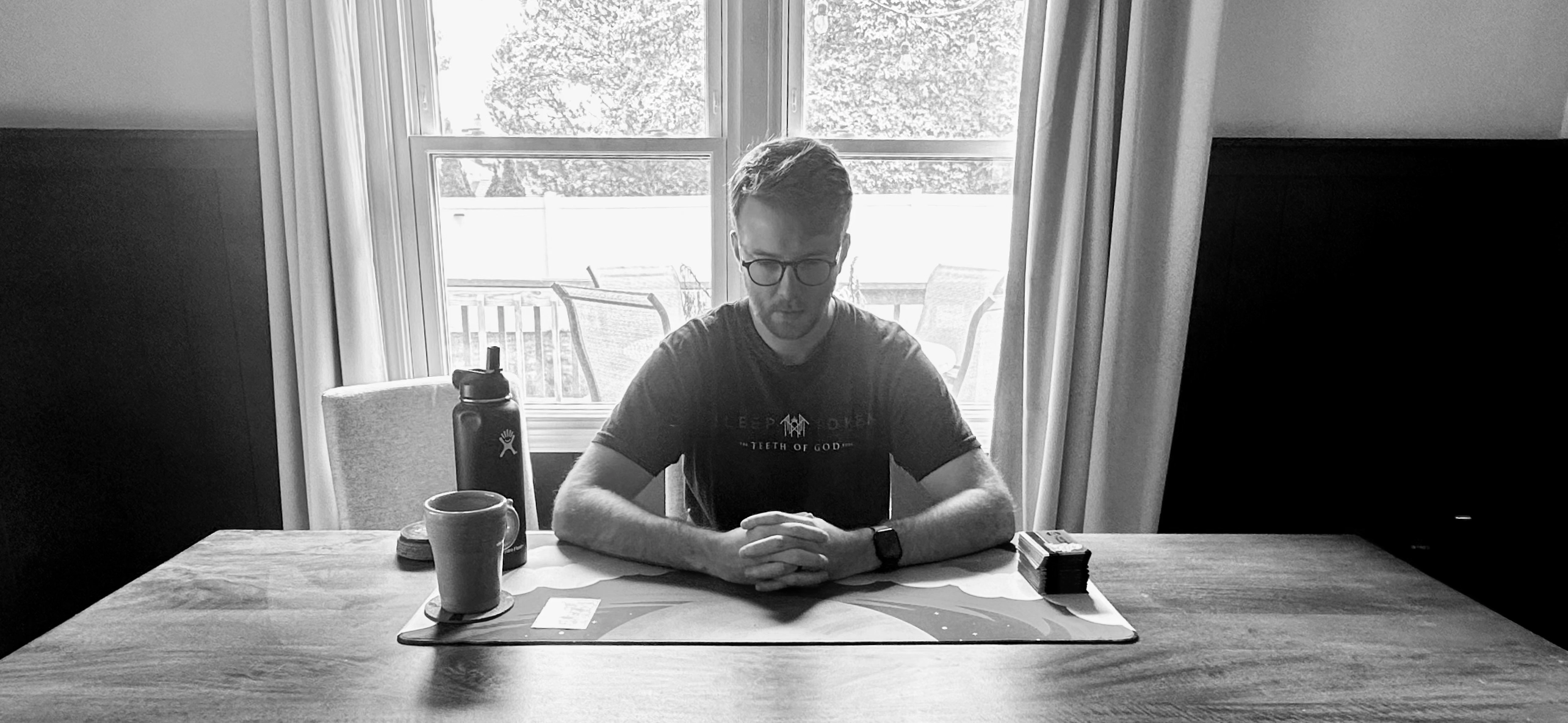 Sprg sits in solace as the sole attendee of his weekly Magic the Gathering game.